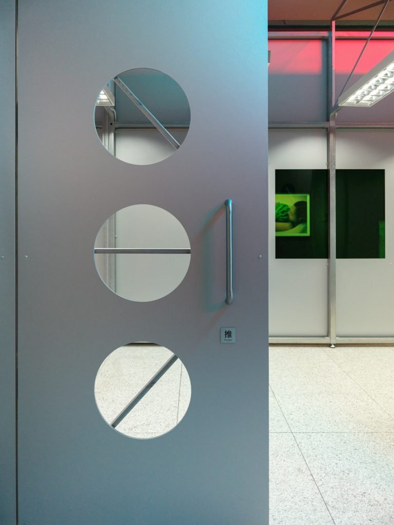 a-large-metal-door-with-circular-cutouts-on-it-lsqfiv95gxi